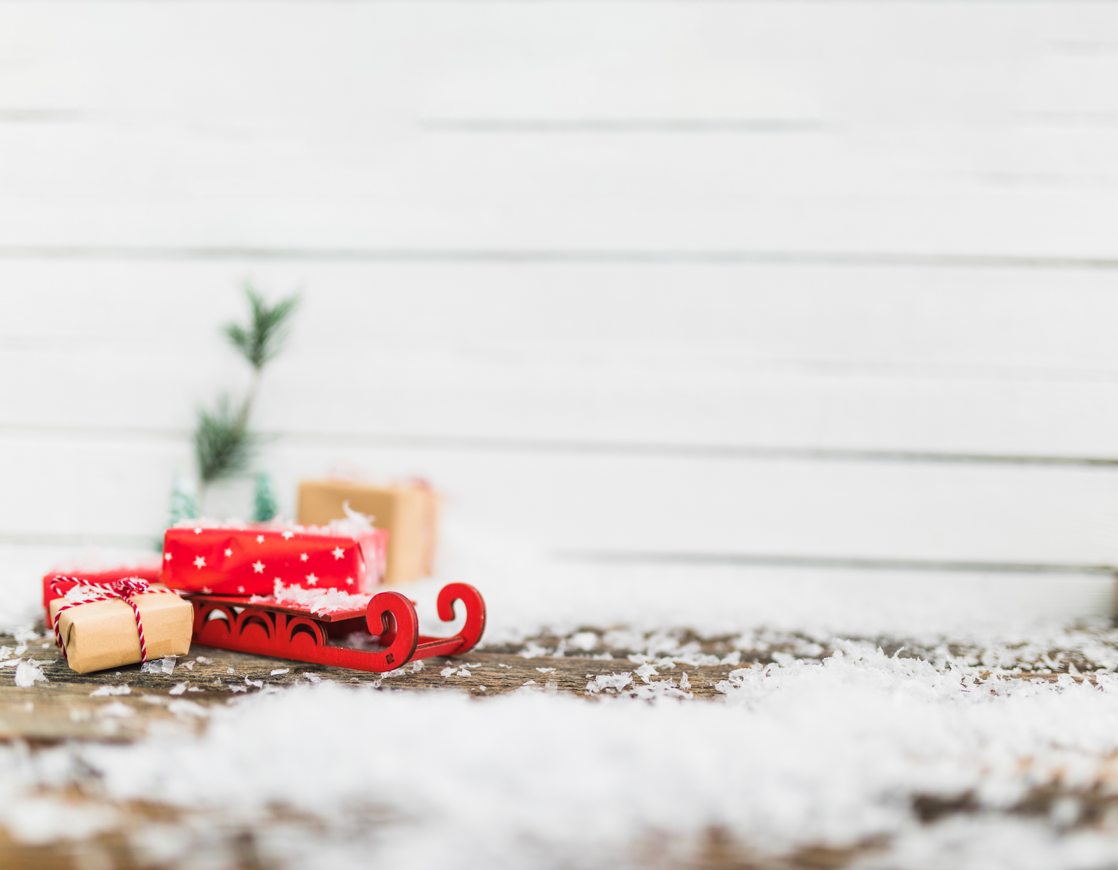 toy-sledge-near-gift-boxes-snowflakes-1